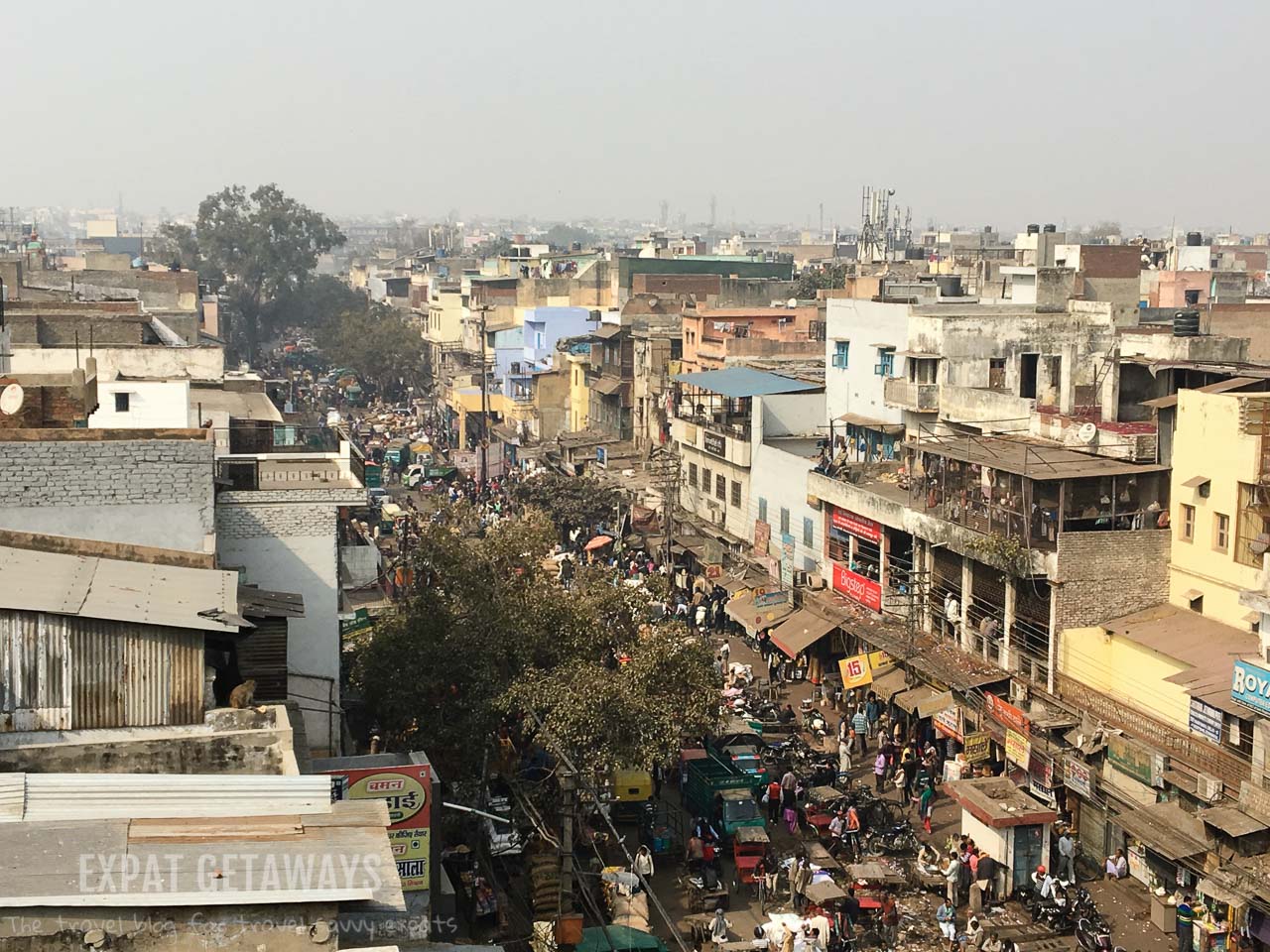 Our Street Connections guide escorted us to a hidden Old Delhi rooftop where we could observe the chaos of the streets below. Expat Getaways, 5 Nights Golden Triangle, Delhi, Jaipur & Agra, India.