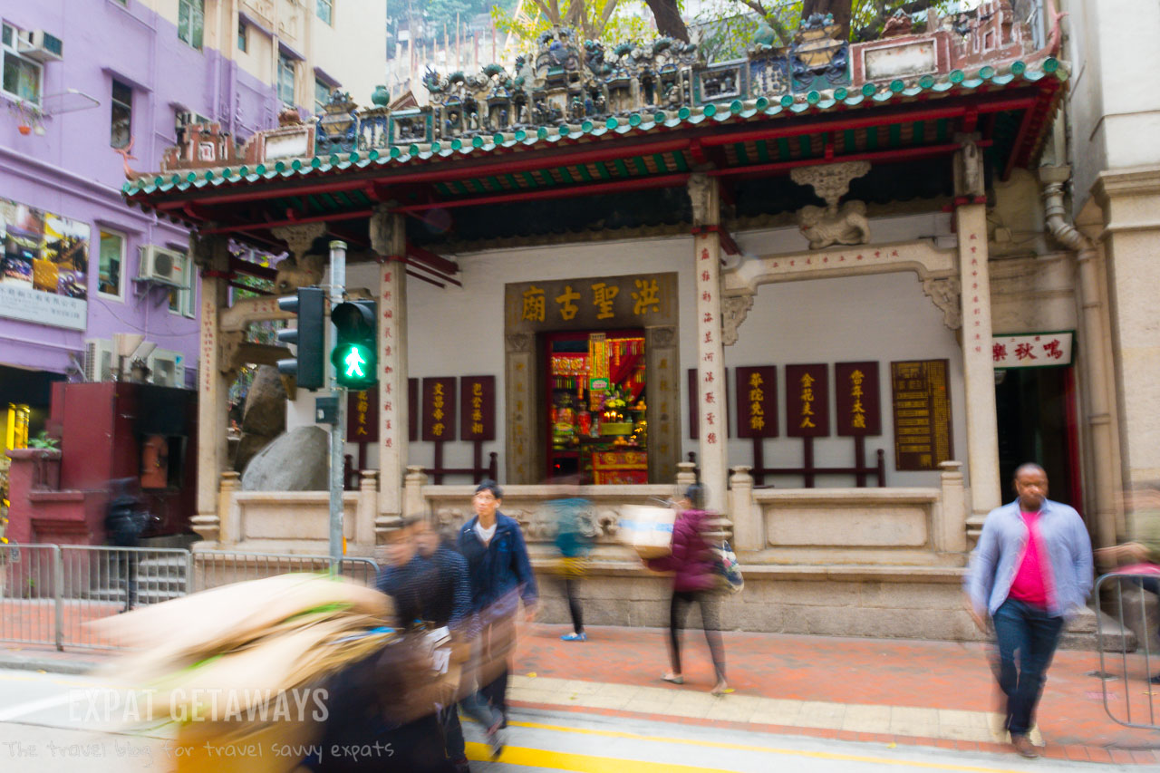The Hung Shing Temple in Wan Chai is built into the side of a boulder on Queens Road East. 