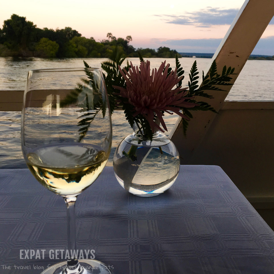 Enjoy a glass of wine while the sunsets over the Zambezi River, Zimbabwe. 
