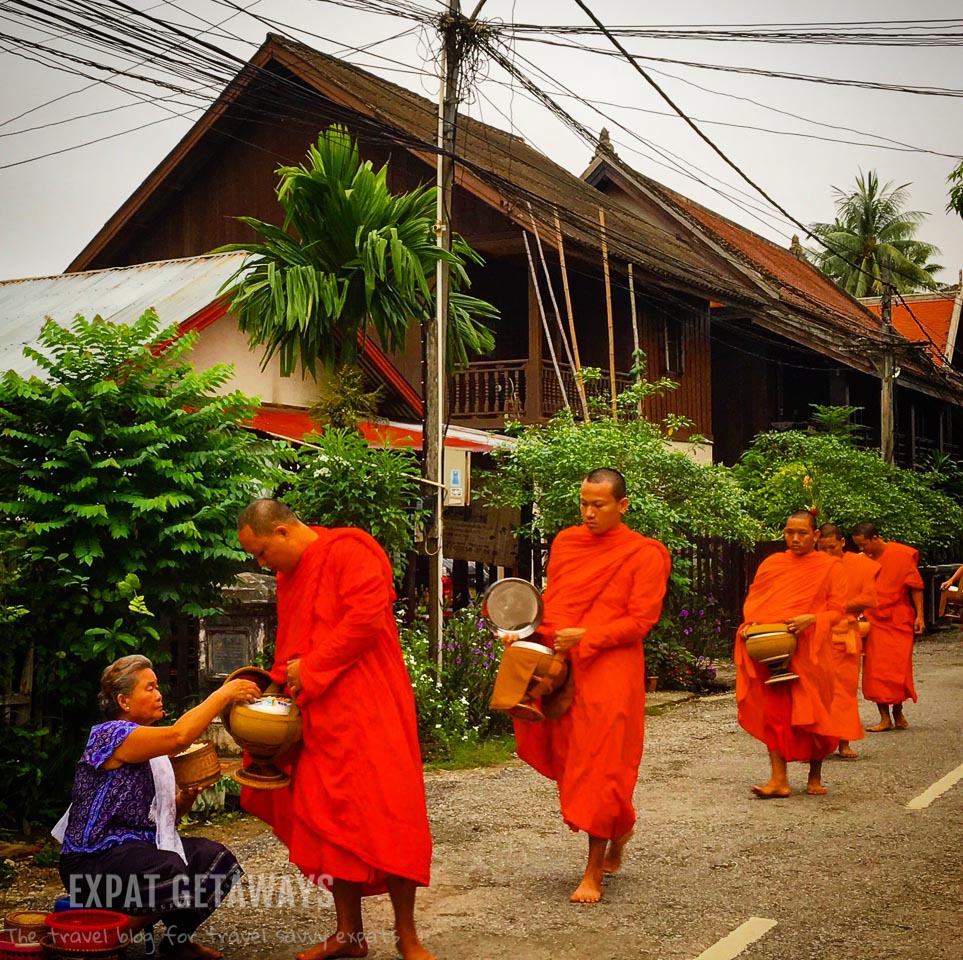 The monks collect sticky rice on their morning alms collection. Luang Prabang, Laos. Expat Getaways, 48 Hours in Luang Prabang, Laos.