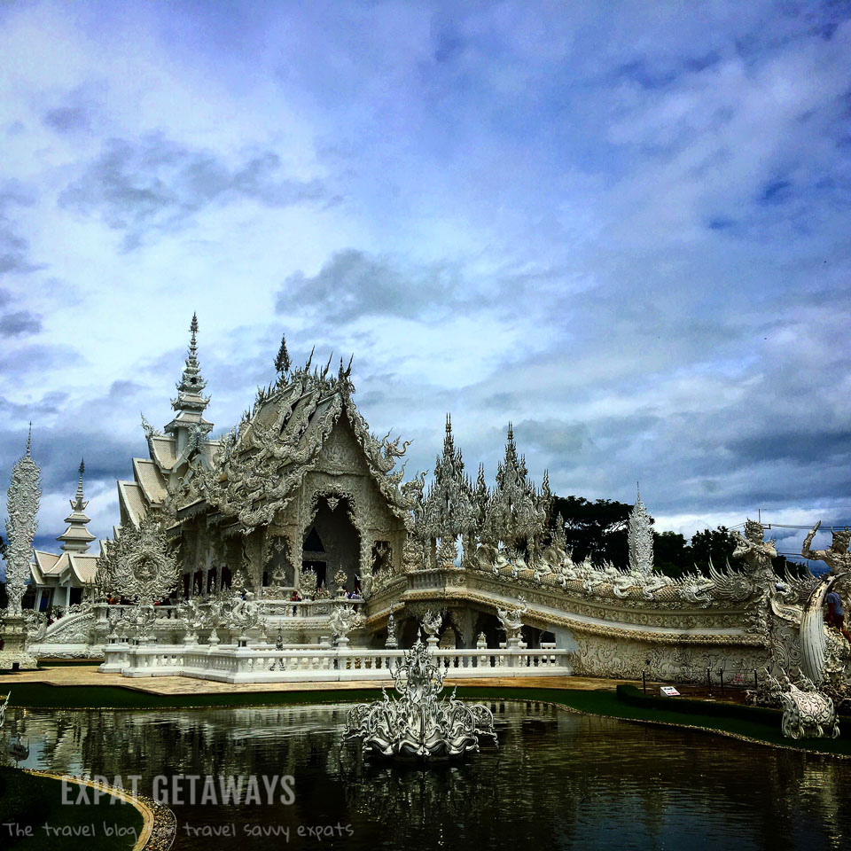 The stunning and slightly odd White Temple in Chiang Rai, Thailand. Expat Getaways - Babymoon Destinations.