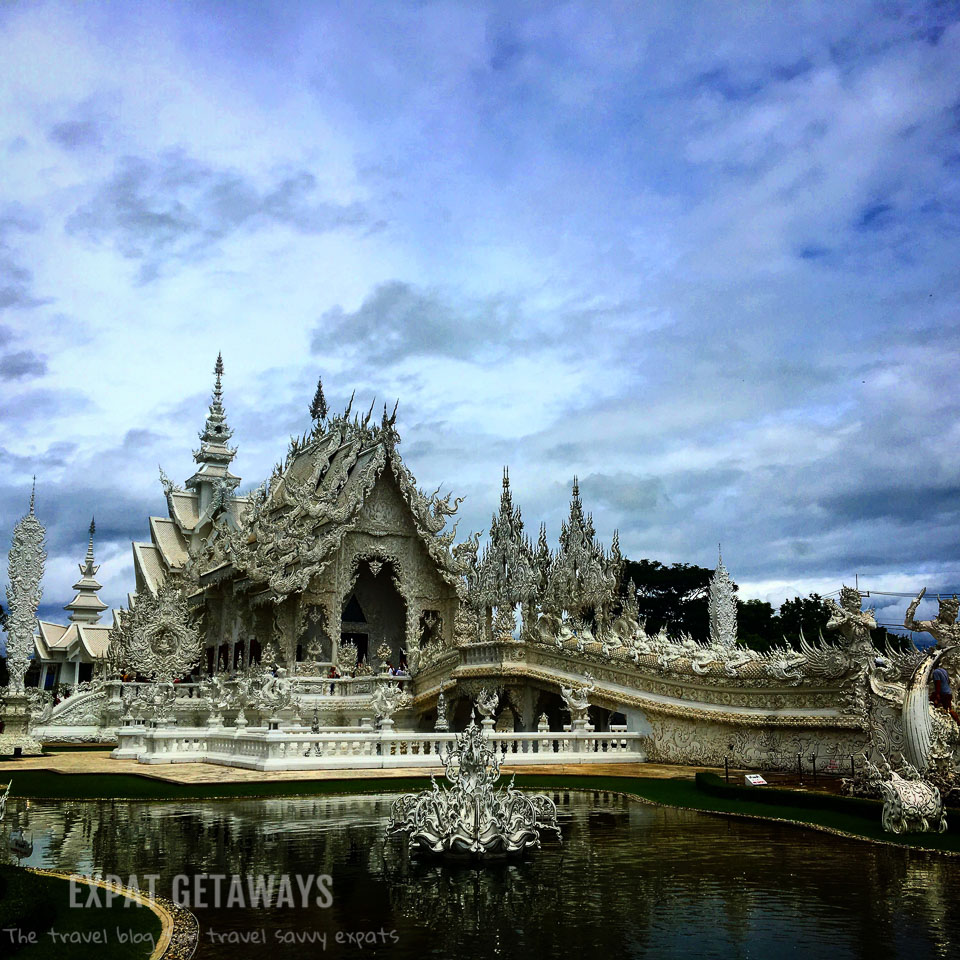 The stunning and slightly odd White Temple in Chiang Rai, Thailand. Expat Getaways - Babymoon Destinations.