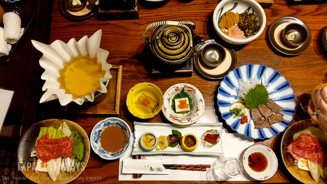 A traditional Japanese dinner at the Kurokawa ryokan. Expat Getaways - Babymoon Destinations.